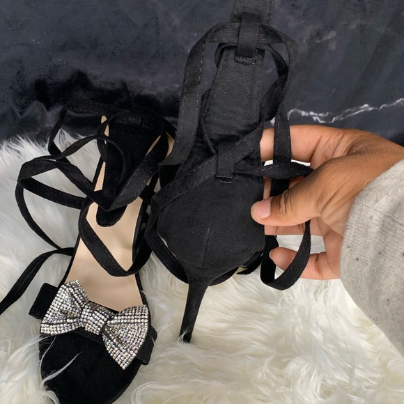 Black wrap around heels with glittery bow on top. - Picture 3 of 8